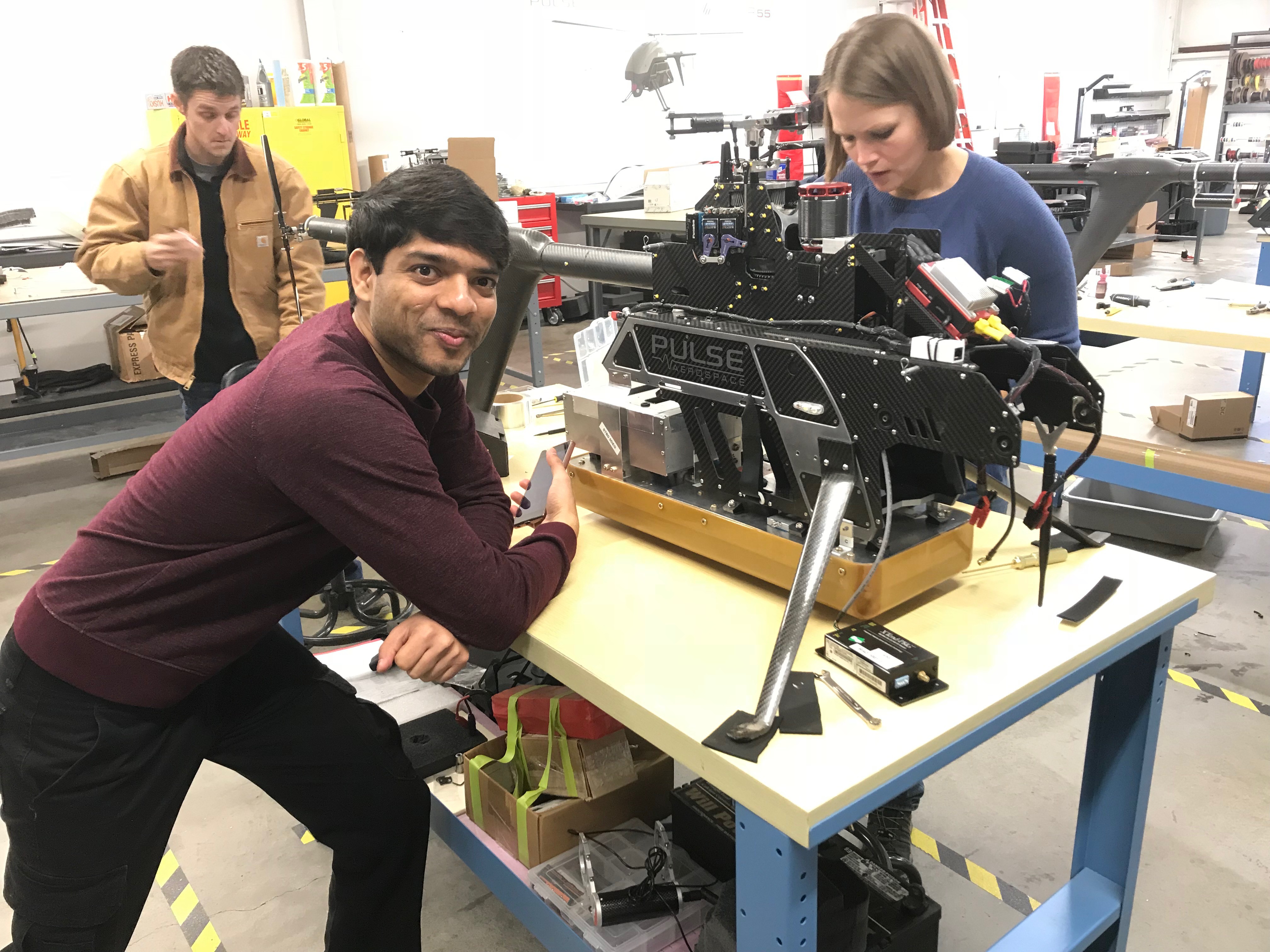 Emily working with 2 other people on the UWB radar.